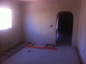 Recently gutted kitchen with new plaster walls